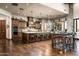 Gourmet kitchen features a large island with seating, custom cabinets, and stone accents at 4610 E Meadowview Dr, Gilbert, AZ 85298