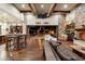 Spacious living room with wood floors, stone columns, high ceilings and an open-concept design at 4610 E Meadowview Dr, Gilbert, AZ 85298