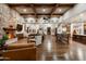 Spacious living room features wood floors, stone fireplace, and wood beam ceiling at 4610 E Meadowview Dr, Gilbert, AZ 85298