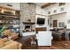 Living room with stone fireplace, wood beams and shelving at 4610 E Meadowview Dr, Gilbert, AZ 85298