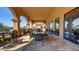 Inviting outdoor patio with ample seating, elegant arches, and scenic views at 4610 E Meadowview Dr, Gilbert, AZ 85298