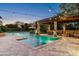 A relaxing backyard pool and gazebo complemented by ambient string lights creating an inviting atmosphere at 4610 E Meadowview Dr, Gilbert, AZ 85298