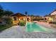 Stunning backyard pool view highlighted by a gazebo and landscape lighting for memorable moments at 4610 E Meadowview Dr, Gilbert, AZ 85298