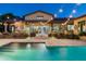 Inviting backyard pool with lush landscaping and string lights for evening enjoyment at 4610 E Meadowview Dr, Gilbert, AZ 85298