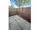 Enclosed backyard patio featuring concrete pavers and a privacy fence at 5345 W Marcus Dr, Phoenix, AZ 85083