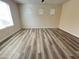 Bright, spacious bedroom with laminate wood flooring and many windows at 5345 W Marcus Dr, Phoenix, AZ 85083