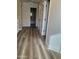 Hallway featuring wood floors and access to the bathroom at 5345 W Marcus Dr, Phoenix, AZ 85083
