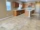 Large kitchen featuring an island, stainless steel appliances, tile floor, and natural light at 5345 W Marcus Dr, Phoenix, AZ 85083