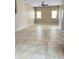 Bright and spacious living room with a ceiling fan and tiled floors at 5345 W Marcus Dr, Phoenix, AZ 85083