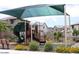Community playground area with shade cover, benches, and various play structures at 5345 W Marcus Dr, Phoenix, AZ 85083