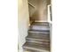 Elegant staircase featuring light wood steps, white trim, and beige walls at 5345 W Marcus Dr, Phoenix, AZ 85083