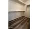 Walk-in closet with a wood floor and installed shelving for optimal organization at 5345 W Marcus Dr, Phoenix, AZ 85083