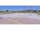 Community basketball court with benches, greenery, and residential homes at 5614 W Saint Moritz Ln, Glendale, AZ 85306