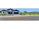 Beautiful single-Gathering home with blue accents, a manicured front yard and a two car garage in a Gathering-friendly neighborhood at 5614 W Saint Moritz Ln, Glendale, AZ 85306