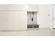 The garage has cabinets, shelving and a bench with storage for your convenience at 5614 W Saint Moritz Ln, Glendale, AZ 85306