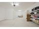 The garage has ample space and is lined with cabinets and shelving for storage at 5614 W Saint Moritz Ln, Glendale, AZ 85306
