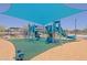 Community playground with swings, slides, and shade structure for neighborhood enjoyment at 5614 W Saint Moritz Ln, Glendale, AZ 85306