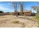 Spacious backyard with mature trees and a view of the house at 6128 W Columbine Dr, Glendale, AZ 85304