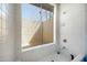 Bright bathroom features a shower with sliding glass door and white tile at 6128 W Columbine Dr, Glendale, AZ 85304