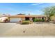 Charming single-story home featuring a brick facade and a low-maintenance front yard at 6128 W Columbine Dr, Glendale, AZ 85304