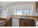 View of the kitchen sink and window with a view of the property's backyard at 6128 W Columbine Dr, Glendale, AZ 85304