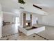 Bright living room with inviting fireplace, beamed ceilings, and an open layout with tile flooring at 6128 W Columbine Dr, Glendale, AZ 85304