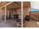 This covered patio features an outdoor grill, seating and a fire pit at 6814 W Berkeley Rd, Phoenix, AZ 85035