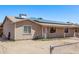 Single-story home featuring solar panels, fenced front yard, neutral paint, and covered entry at 6814 W Berkeley Rd, Phoenix, AZ 85035