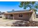 Single-story home featuring solar panels, fenced front yard, neutral paint, and covered entry at 6814 W Berkeley Rd, Phoenix, AZ 85035