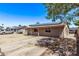 Single-story home featuring solar panels, fenced front yard, neutral paint, and covered entry at 6814 W Berkeley Rd, Phoenix, AZ 85035