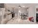 Eat-in kitchen with tile flooring, ceiling fan, and stainless steel refrigerator and range at 6814 W Berkeley Rd, Phoenix, AZ 85035