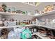 Walk-in pantry with an abundance of shelving stocked with food and kitchen supplies at 6814 W Berkeley Rd, Phoenix, AZ 85035