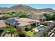 Beautiful backyard featuring solar panels, desert landscaping, pool and covered patio at 6886 W Mazatzal Dr, Peoria, AZ 85383