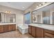 Bathroom featuring dual sink vanity, bathtub, and large mirror at 6886 W Mazatzal Dr, Peoria, AZ 85383