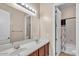 Bright bathroom featuring double sinks, wood cabinets, and shower/tub combination at 6886 W Mazatzal Dr, Peoria, AZ 85383