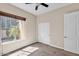 Bright bedroom featuring natural light from a large window, with neutral walls and carpet at 6886 W Mazatzal Dr, Peoria, AZ 85383