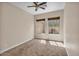 Well-lit bedroom with carpet, and windows providing natural light at 6886 W Mazatzal Dr, Peoria, AZ 85383