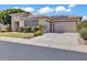 Charming single-story home featuring desert landscaping, stone accents, and a two-car garage at 6886 W Mazatzal Dr, Peoria, AZ 85383
