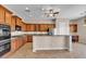Well-equipped kitchen with ample cabinetry, stainless steel appliances, and a breakfast bar with stylish granite countertops at 6886 W Mazatzal Dr, Peoria, AZ 85383