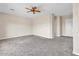 Expansive living room features plush carpeting and ample natural light at 6886 W Mazatzal Dr, Peoria, AZ 85383