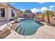 Beautiful pool with baja steps and desert landscaping with mature palm trees at 6886 W Mazatzal Dr, Peoria, AZ 85383
