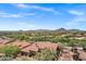 Scenic aerial view showcases the neighborhood with desert landscaping, nearby golf course, and mountain backdrop at 7134 E Sandia St, Mesa, AZ 85207
