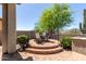 Cozy backyard patio with seating, lush greenery, and serene atmosphere at 7134 E Sandia St, Mesa, AZ 85207