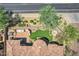 Overhead shot of a private outdoor area with lush landscaping, a built-in grill, and outdoor seating at 7134 E Sandia St, Mesa, AZ 85207