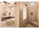 Spa-like bathroom with tile shower, a soaking tub, and plenty of natural light at 7134 E Sandia St, Mesa, AZ 85207