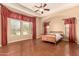 Serene primary bedroom with tray ceilings, decorative drapery, and ample natural light at 7134 E Sandia St, Mesa, AZ 85207
