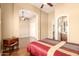 Well-lit bedroom with multiple doorways and hardwood flooring at 7134 E Sandia St, Mesa, AZ 85207