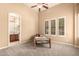Comfortable bedroom with a carpeted floor, ceiling fan, and natural lighting at 7134 E Sandia St, Mesa, AZ 85207