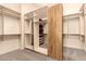 Walk-in closet with custom shelving for storage at 7134 E Sandia St, Mesa, AZ 85207