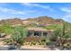 Beautiful home featuring desert landscaping, a red tile roof, neutral stucco, and mountain views at 7134 E Sandia St, Mesa, AZ 85207